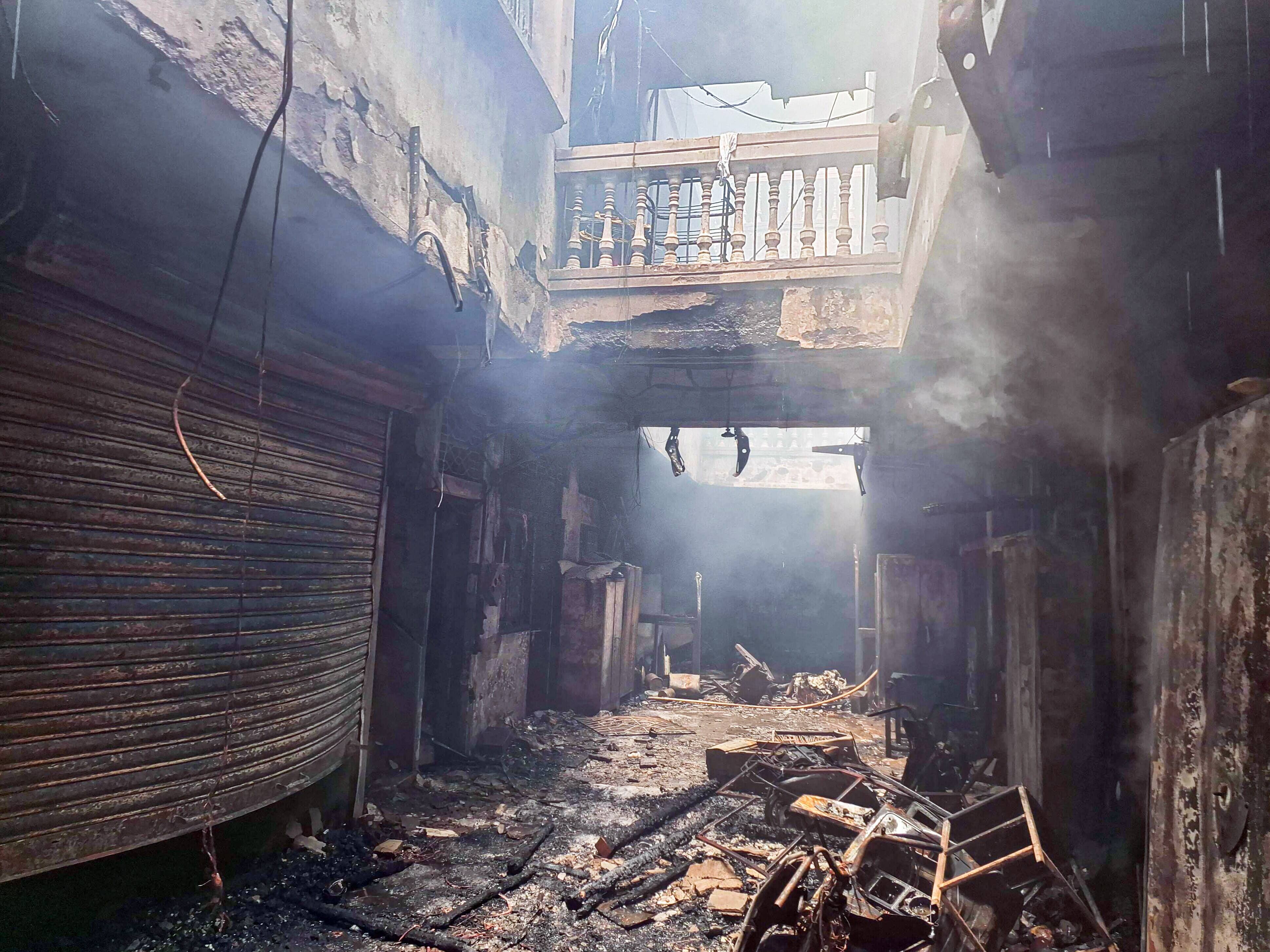 A view of the charred remains of the interior after a fire broke out at the Gulzar House
