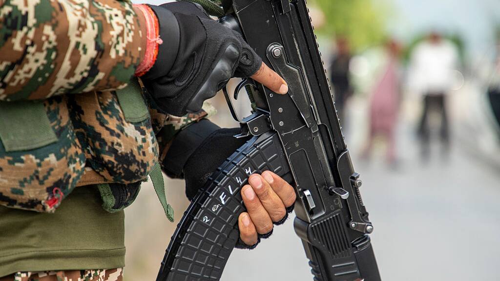 Indian Paramilitary soldier stands alert in Srinagar