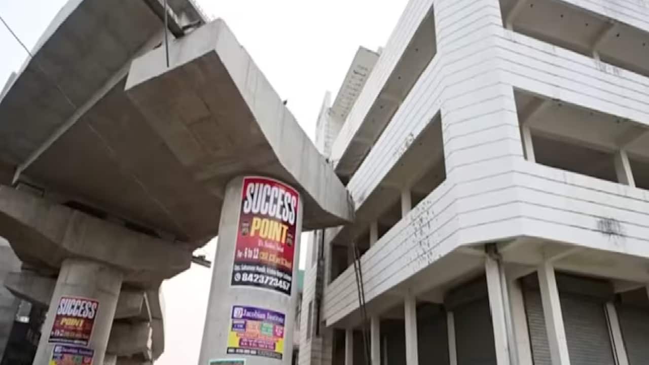 lucknow railway overbridge construction halted compensation dispute