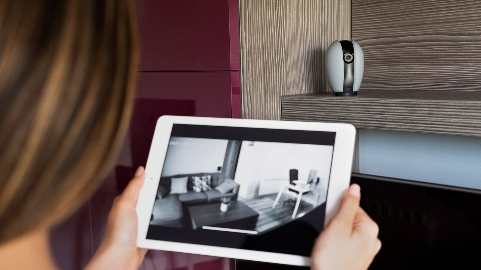 woman checking security camera