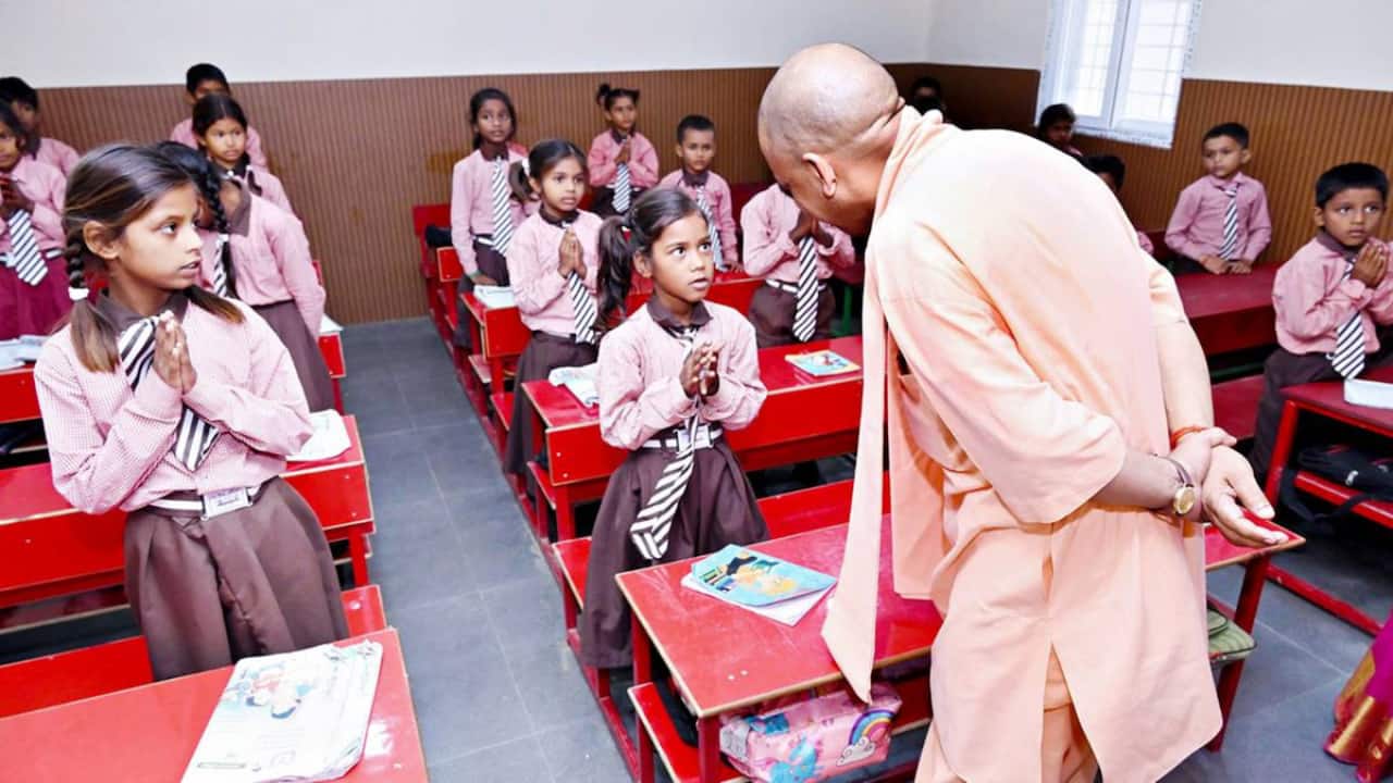 up school merger controversy cm yogi vs opposition