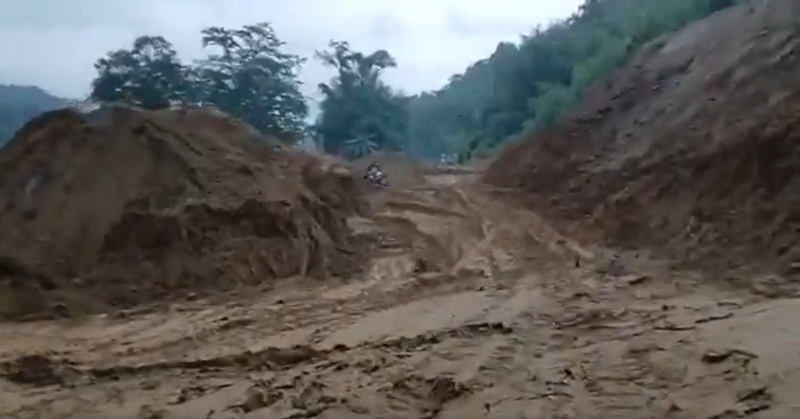 Terrifying Moment On Camera: Landslide Drags Biker Down Mountainside; He Survives (WATCH)