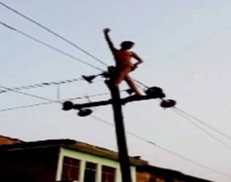 Drunk man climbs on high voltage wires