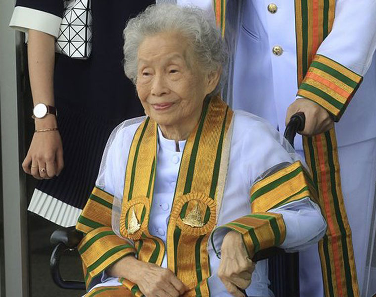 old woman arns bachelors degree in thai