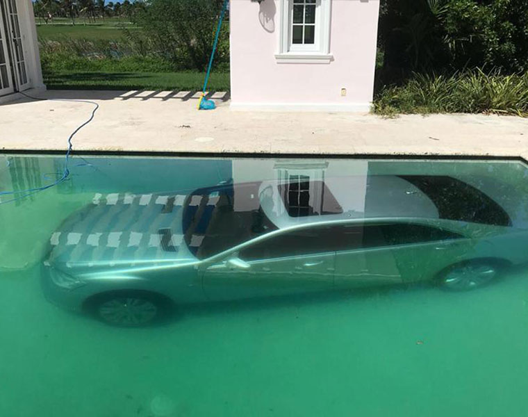 girlfriend of wall street banker puts his mercedes in a swimming pool