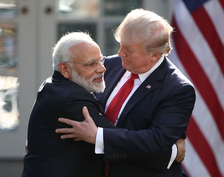 Was this US guard opening the left door of the car expecting Mrs Modi