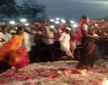 Devotees walk through a pool of fire, risking many lives in the name of god!