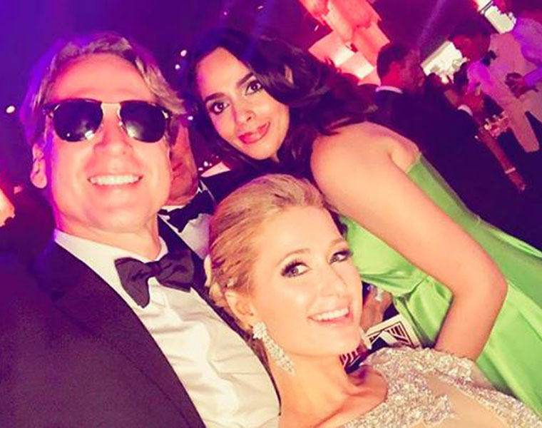 What is Mallika Sherawat doing with Paris Hilton