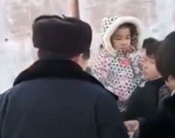 Chinese prisoner being led to his execution breaks down and cries as his toddler daughter