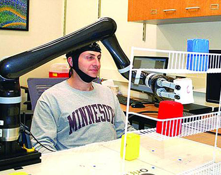 Amazing brain cap lets humans control a robotic arm using only their MINDS