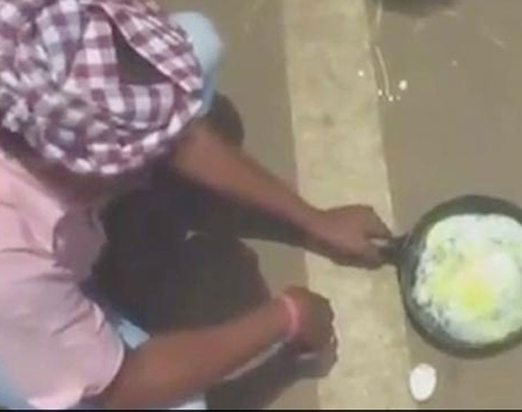 WATCH Man cooks an egg on the road in Titalgarh