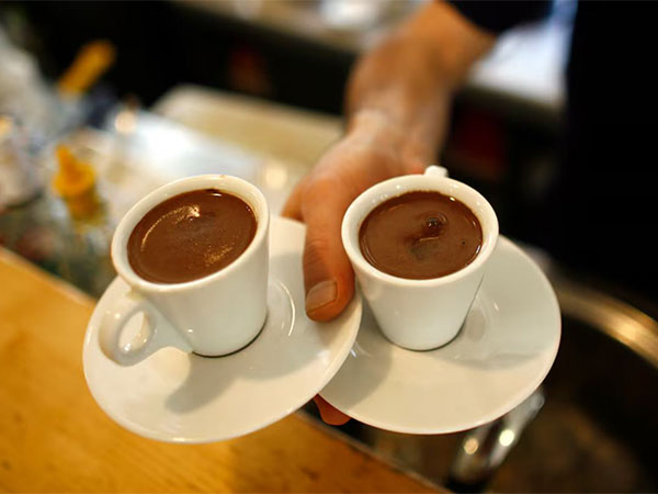 A waiter carries two cups of Turkish coffee at a coffee shop in Istanbul (Image/Reuters) A waiter carries two cups of Turkish coffee at a coffee shop in Istanbul (Image/Reuters)