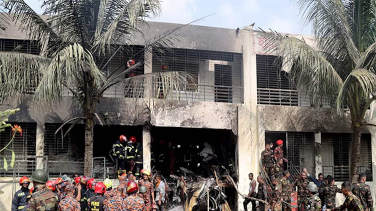 Firefighters and soldiers at the crash site of a Bangladesh Air Force training jet in Dhaka. (Source: Reuters)