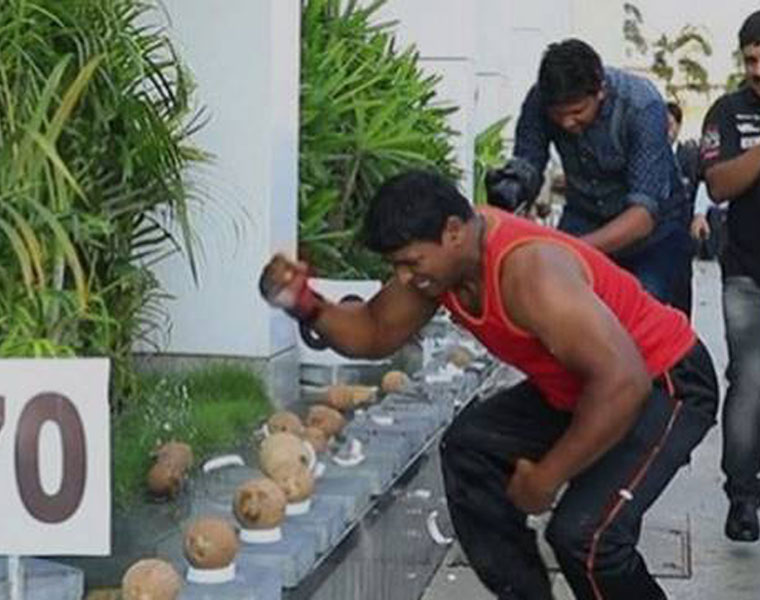 Breaking Guinness World Records a coconut with a hammer can be challenging