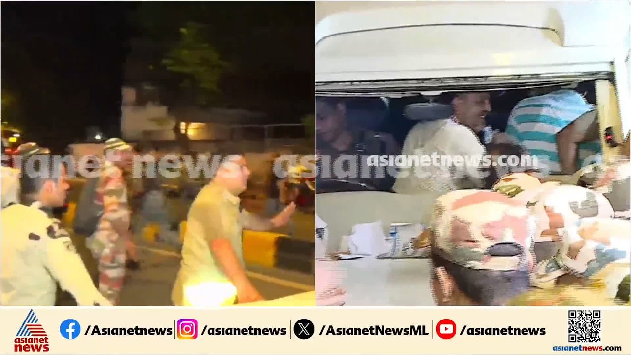 രാഹുൽ ഗാന്ധിയെ അറസ്റ്റ് ചെയ്ത് കൊണ്ടുപോകുന്ന വാഹനം മുന്നോട്ട് നീങ്ങാൻ അനുവദിക്കാതെ പ്രവർത്തകർ